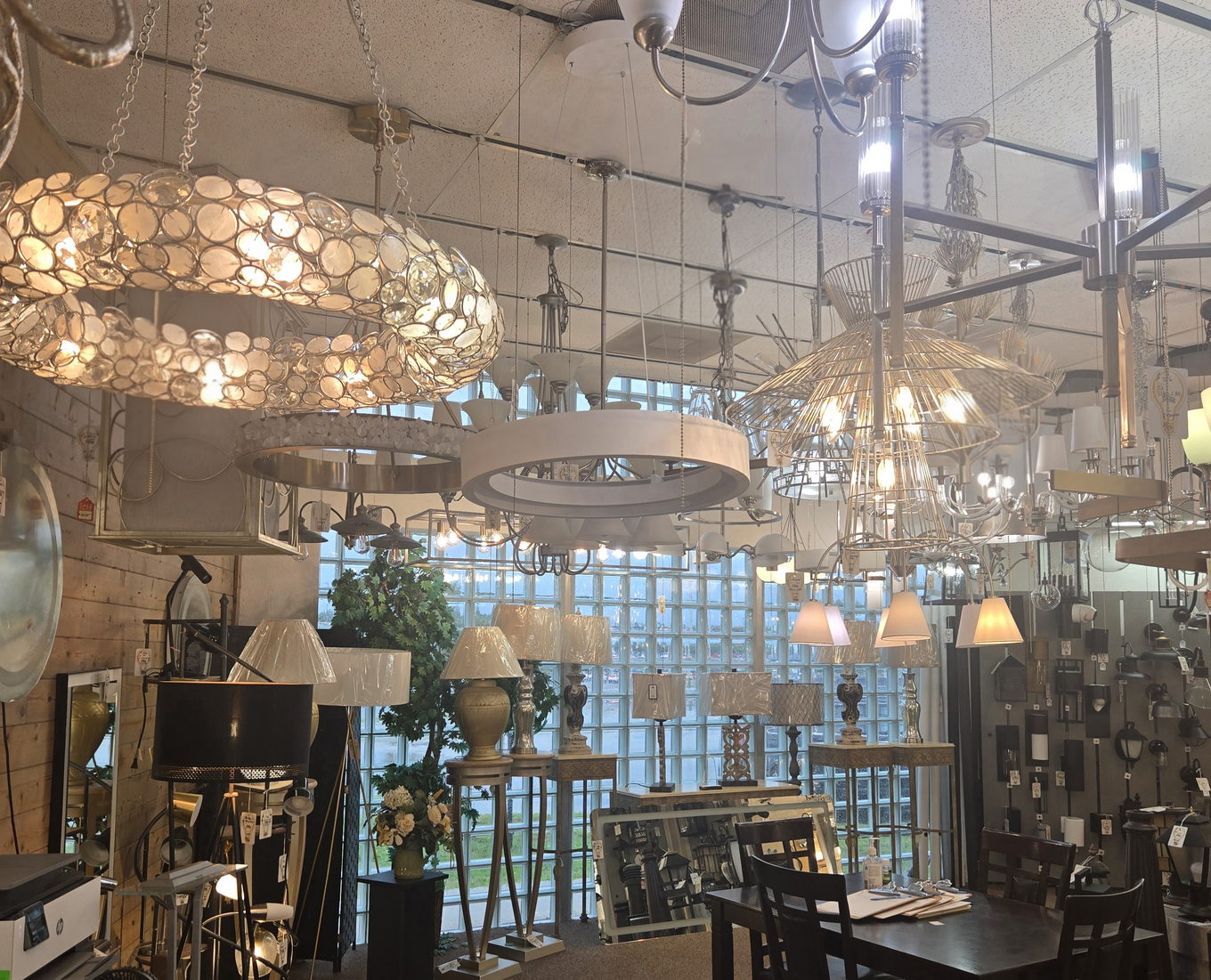 Atmospheric view of chandeliers and lamps in the Wholesale Lighting showroom